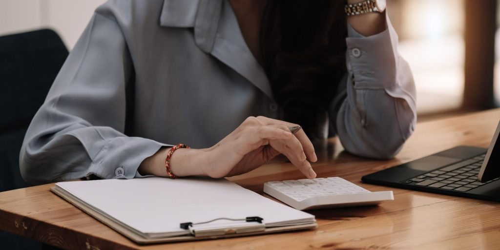 woman doing tax prep at a desk
