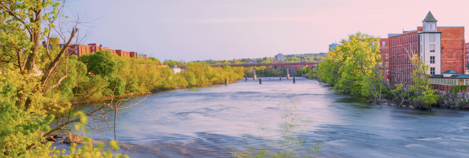 Manchester skyline, New Hampshire over the Merrimack River panorama at sunrise